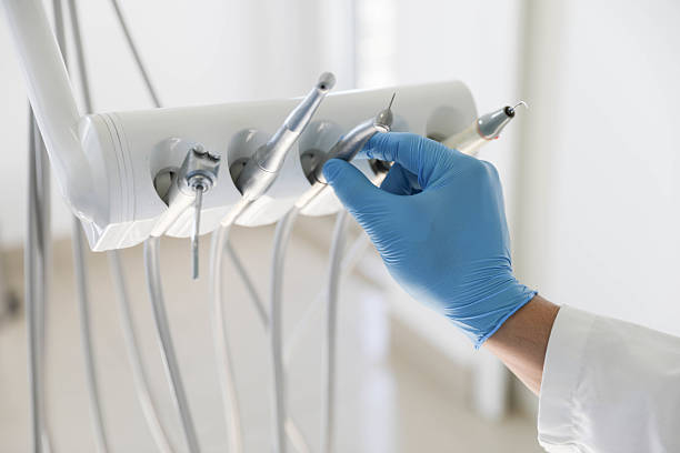 Professional Tooth Extraction technician working in Greenville, NC
